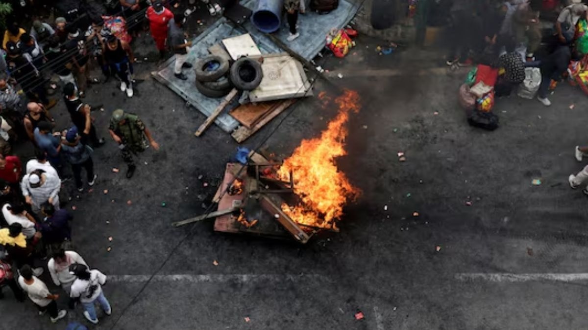 Prisoners burn furniture and other items outside the Dilli Bazaar jail as they try to breakout. (Reuters Photo)