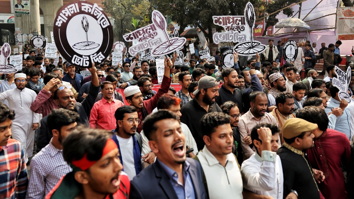 Supporters of the National Citizen Party (NCP) hold placards while joining in the election campaign rally in Dhaka