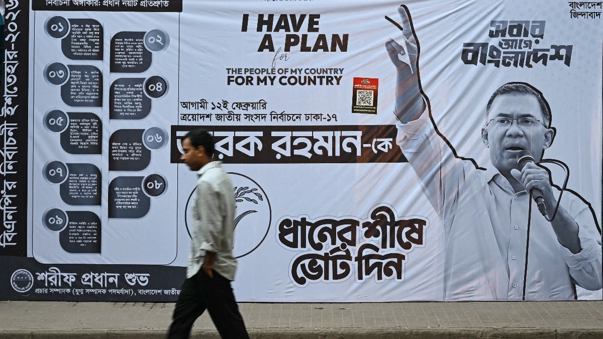  A man walks past a campaign poster of Bangladesh Nationalist Party (BNP) chairman and election candidate Tarique Rahman