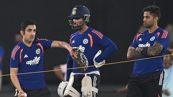 Coach Gautam Gambhir (L) interacts with Tilak Varma (C) and Suryakumar Yadav of India during an ICC Men's T20 World Cup India & Sri Lanka 2026 net session at Narendra Modi Stadium (getty)