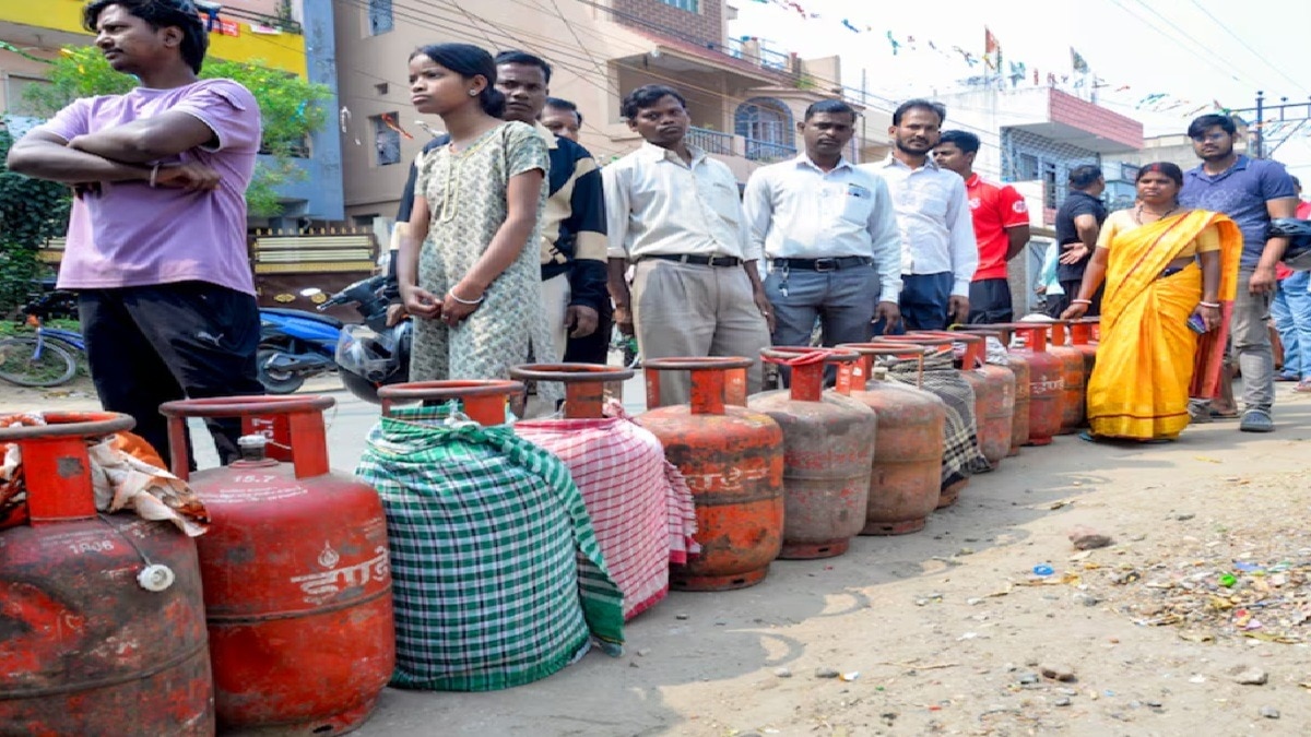 People wait in a queue to receive LPG cylinders in Ranchi, Jharkhand, on March 7.