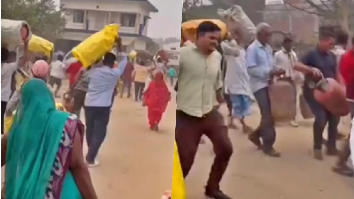 People running towards Gas agency with cylinders in basti (Photo- Screngrab)