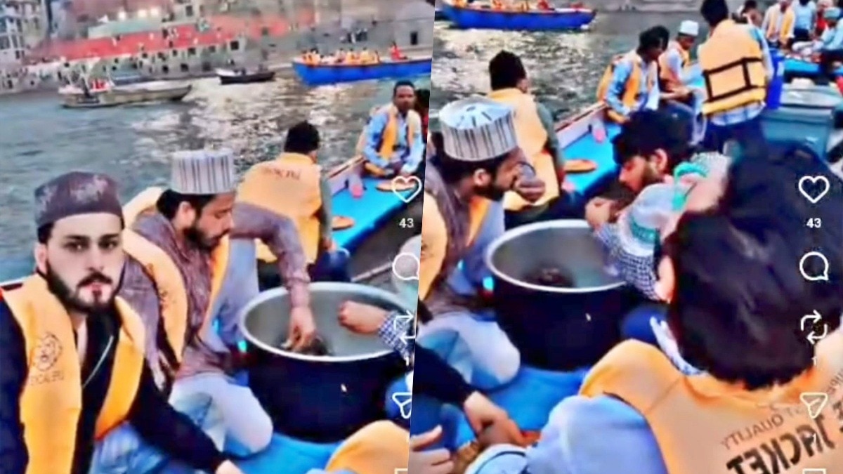 गंगा में नाव पर नॉनवेज खाते वीडियो वायरल (Photo- Screengrab)