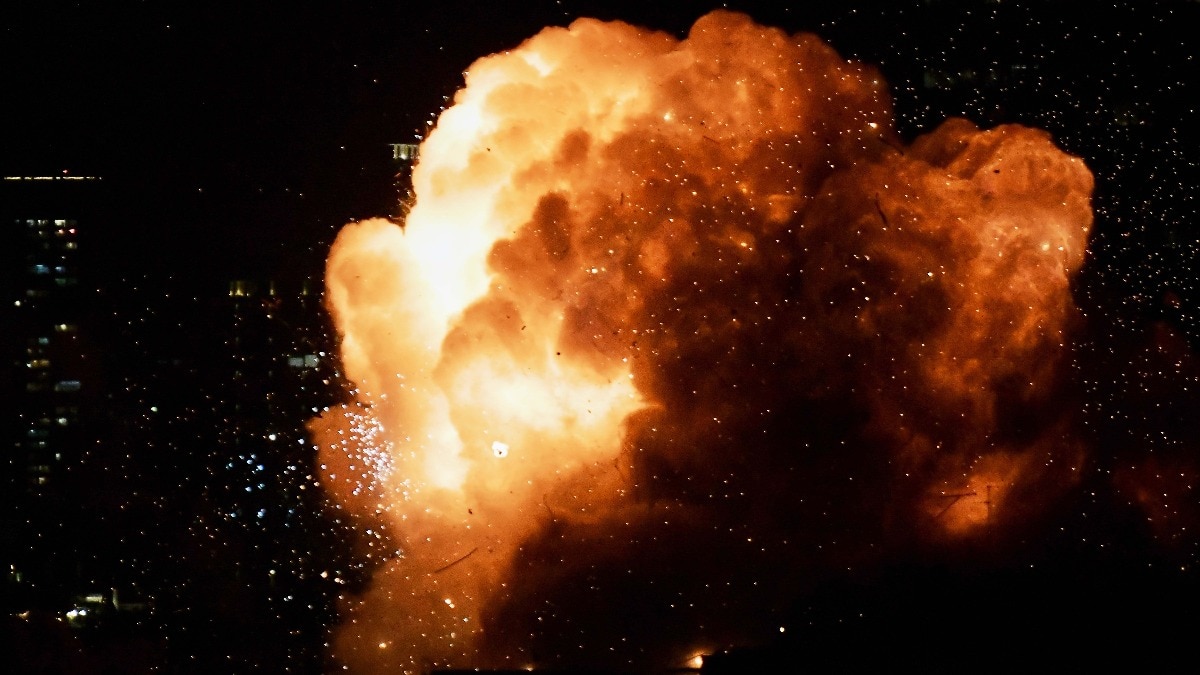 An explosion is seen as an Iranian missile directly hits a building in Tel Aviv, Israel, Saturday, Feb. 28, 2026. (AP Photo/Tomer Neuberg)