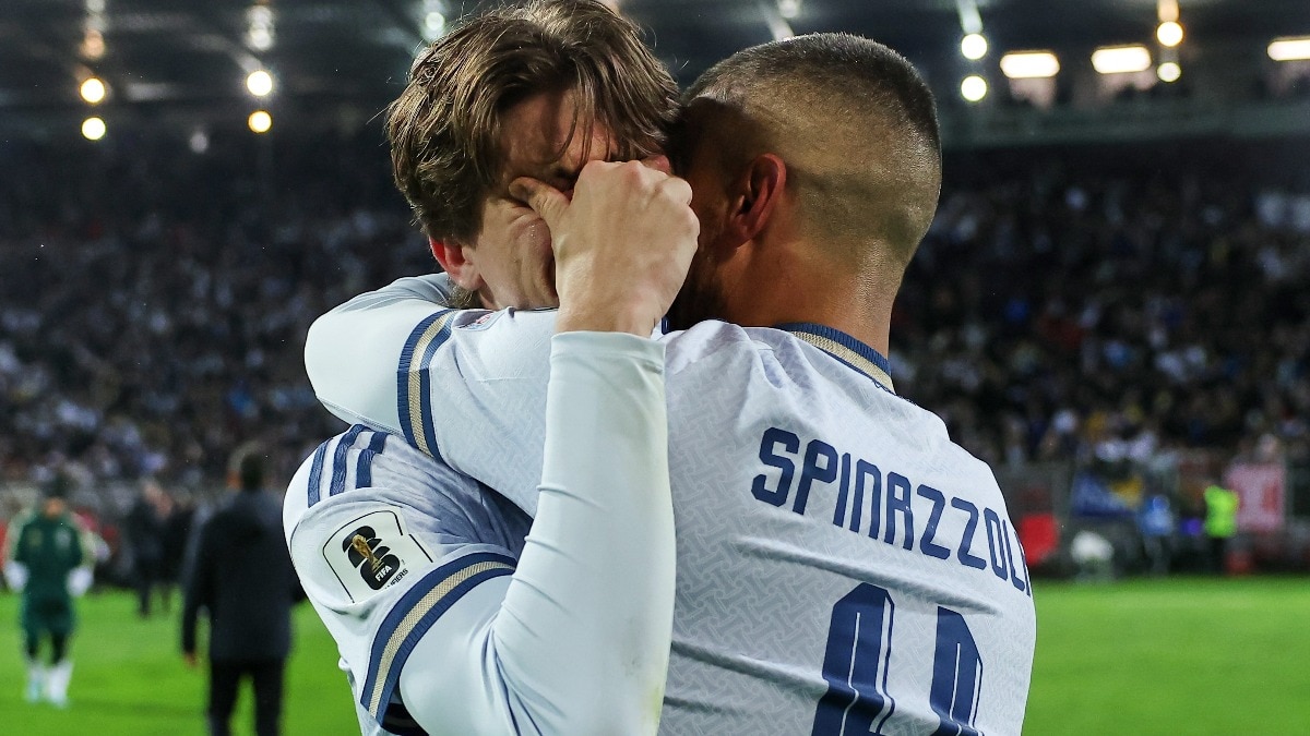Italy's Marco Palestra, left, and Leonardo Spinazzola console each other after losing a penalty shootout.