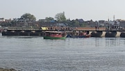 In Vrindavan, a steamer full of tourists collided with a pontoon bridge and capsized in the Yamuna river, killing 10 people In Vrindavan, a steamer full of tourists collided with a pontoon bridge and capsized in the Yamuna river, killing 10 people