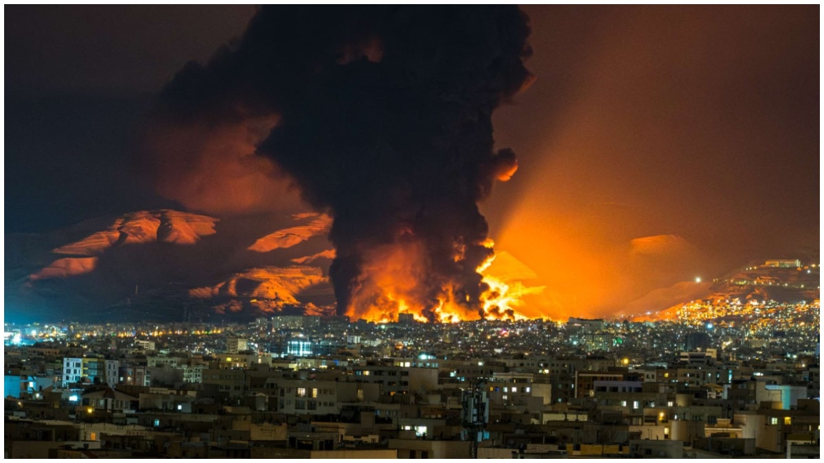 Smoke and flames rise at the site of airstrikes on an oil depot in Tehran on March 7, 2026.