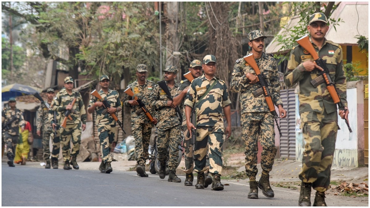 Security forces personnel conduct a route march ahead of the announcement of dates for the West Bengal Assembly elections, in Balurghat, Dakshin Dinajpur district of West Bengal