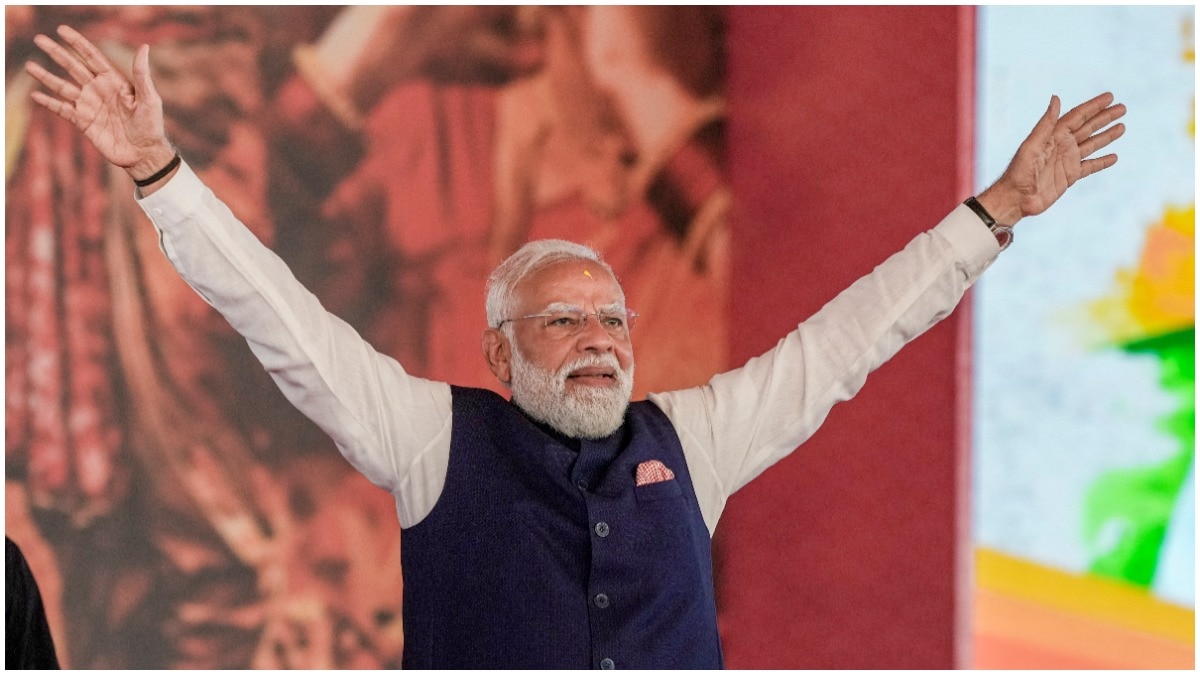 Prime Minister Narendra Modi greets a gathering at Brigade Parade Ground in Kolkata