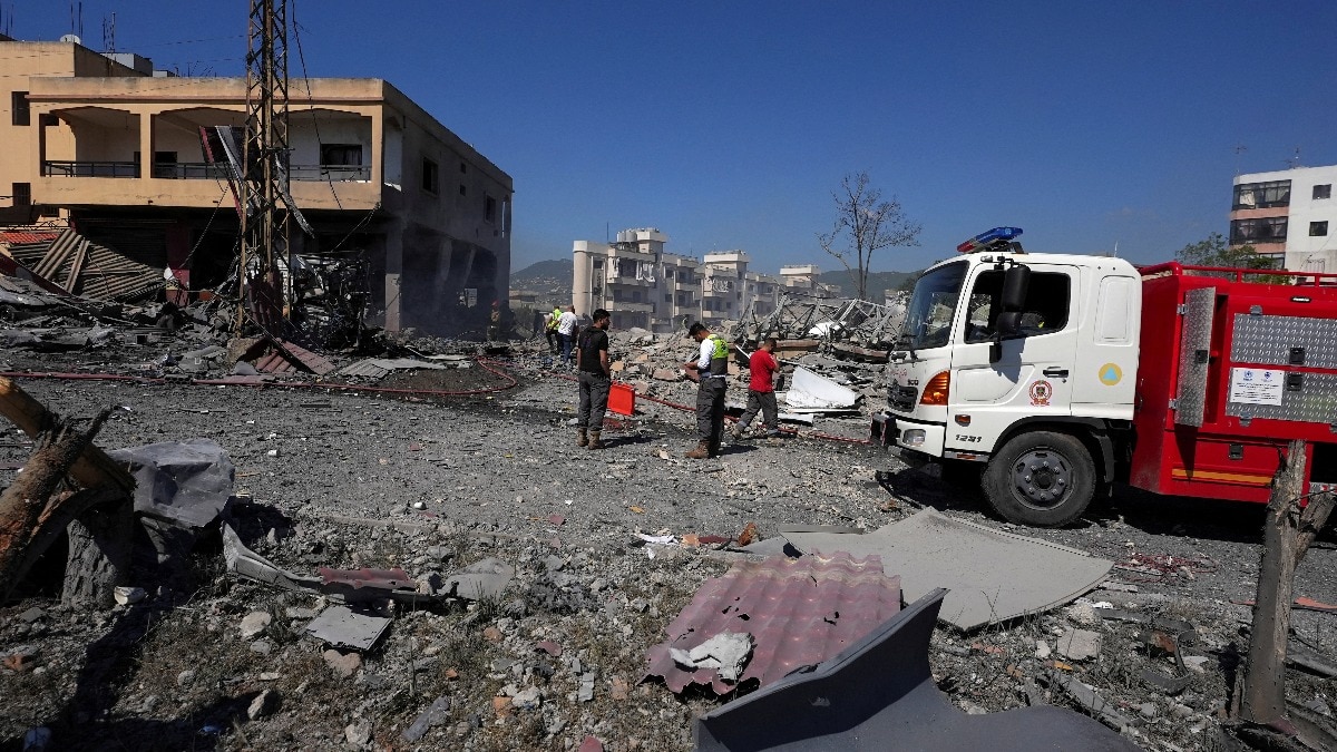 Emergency personnel work at the site of an Israeli strike on a building in Habboush, Lebanon, May 7, 2026.