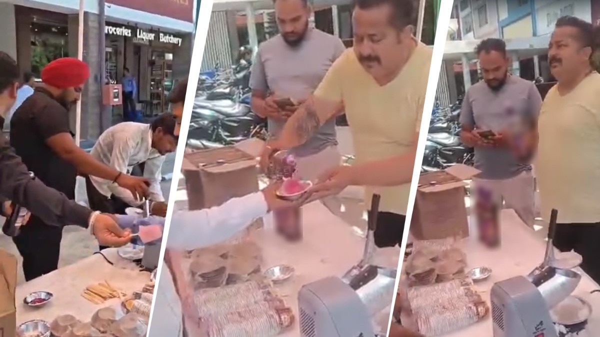 सार्वजनिक जगह पर शराब बांटने से बढ़ा विवाद. (Photo: Screengrab)