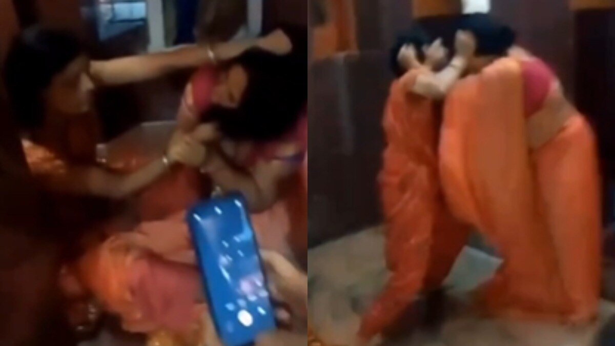 ट्रस्ट अध्यक्ष और पुजारी की पत्नी में मारपीट.(Photo: Screengrab)