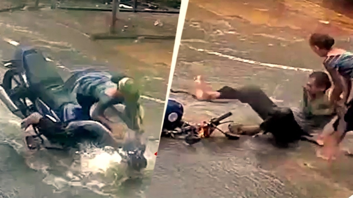 बाइक सवार दंपति गड्ढे में गिरा. (Photo: Screengrab)