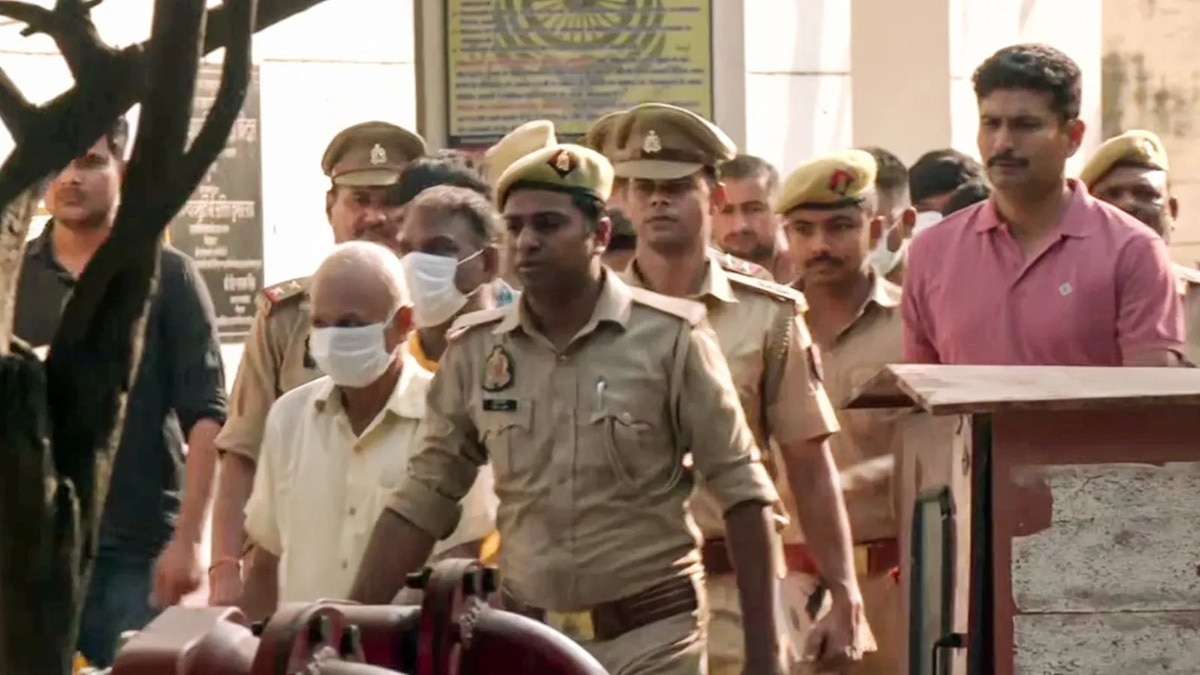 Police taking the accused in the Ayodhya Ram Mandir offering theft case to jail following a court hearing