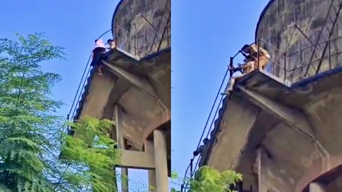 हवा में लटकी छात्रा, पुलिस ने कड़ी मशक्कत से बचाया (Photo- Screengrab)