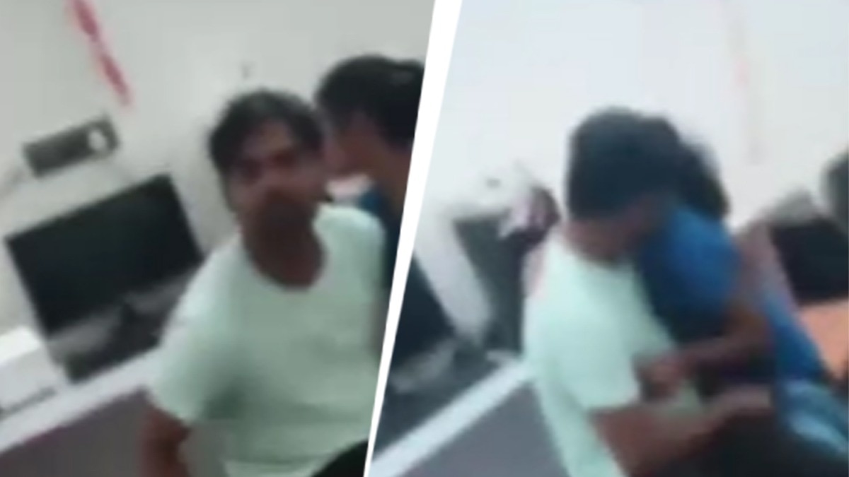 भाई ने शिक्षक को पकड़ा और पीटा.(Photo: Screengrab)