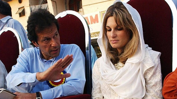 Jemima Khan (R) wife of Pakistan's cricket legend turned politician Imran Khan, reads her prepared statement in local Urdu language as Khan looks on during a public rally to boost her husband's election campaign in Islamabad.