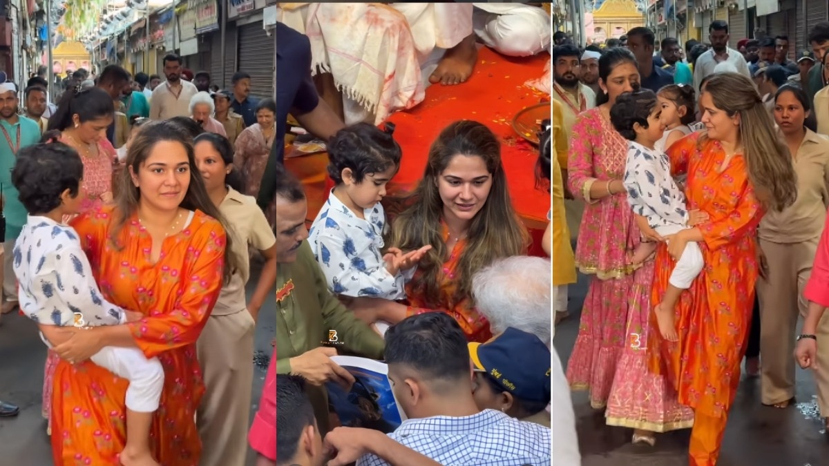 अंजलि मर्चेंट को ऑरेंज सूट में दर्शन के लिए पहुंचते देखा गया. (Photo: Instagram/Screengrab)