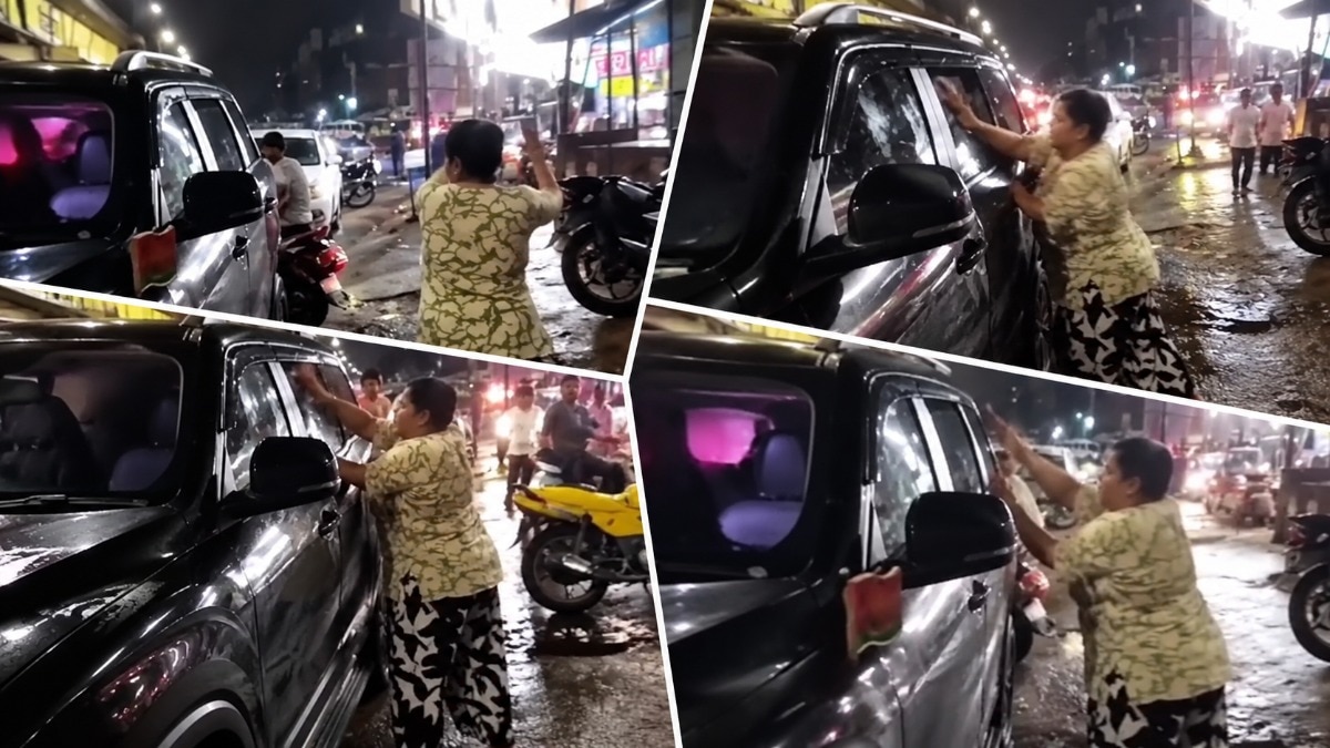 महिला ने स्कॉर्पियो के शीशे तोड़े. (Photo: Screengrab)