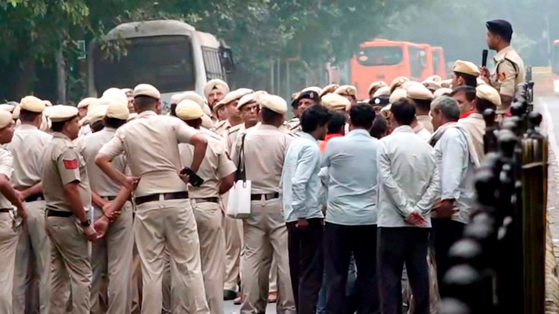 Around 50 protesters gathered near the PTI building in the New Delhi area and pelted stones at the police, injuring two police personnel.