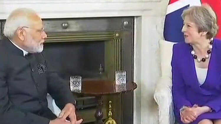 पीएम मोदी और थेरेसा मे