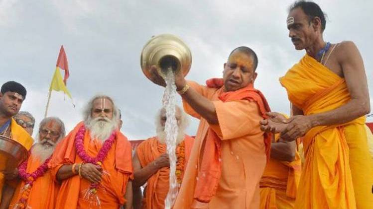 Uttar Pradesh Chief Minister Yogi Adityanath performed rituals at bank of Sarayu river in Ayodhya (Courtesy-PTI)