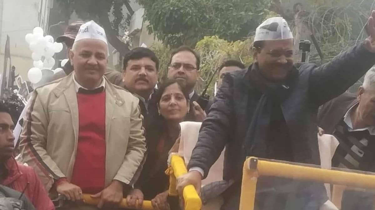 Delhi CM and Aam Aadmi Party leader Arvind Kejriwal holds road show while on his way to file nomination from New Delhi assembly seat. (Photo ANI)