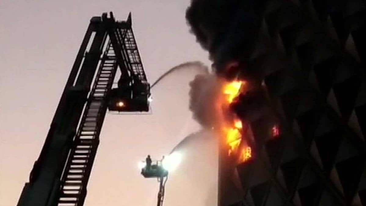 Gujarat: Fire breaks out in Raghuveer Market in Surat. 40 fire tenders at the spot (Photo ANI)