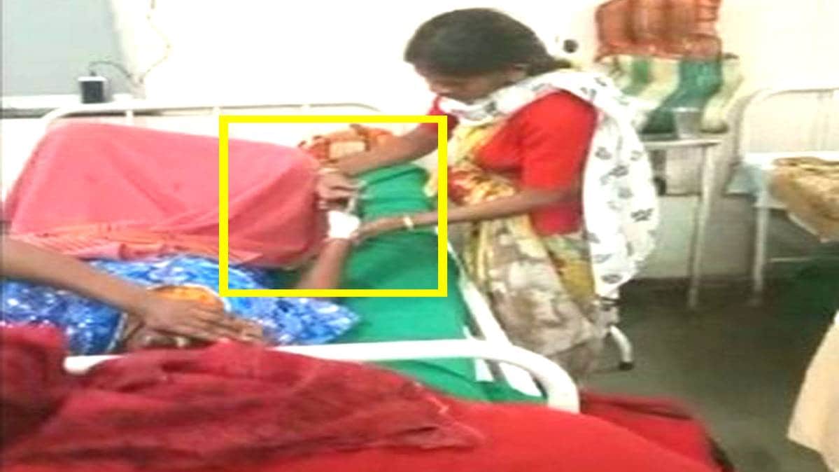 मरीज को इंजेक्शन लगाते हुए महिला सफाईकर्मी