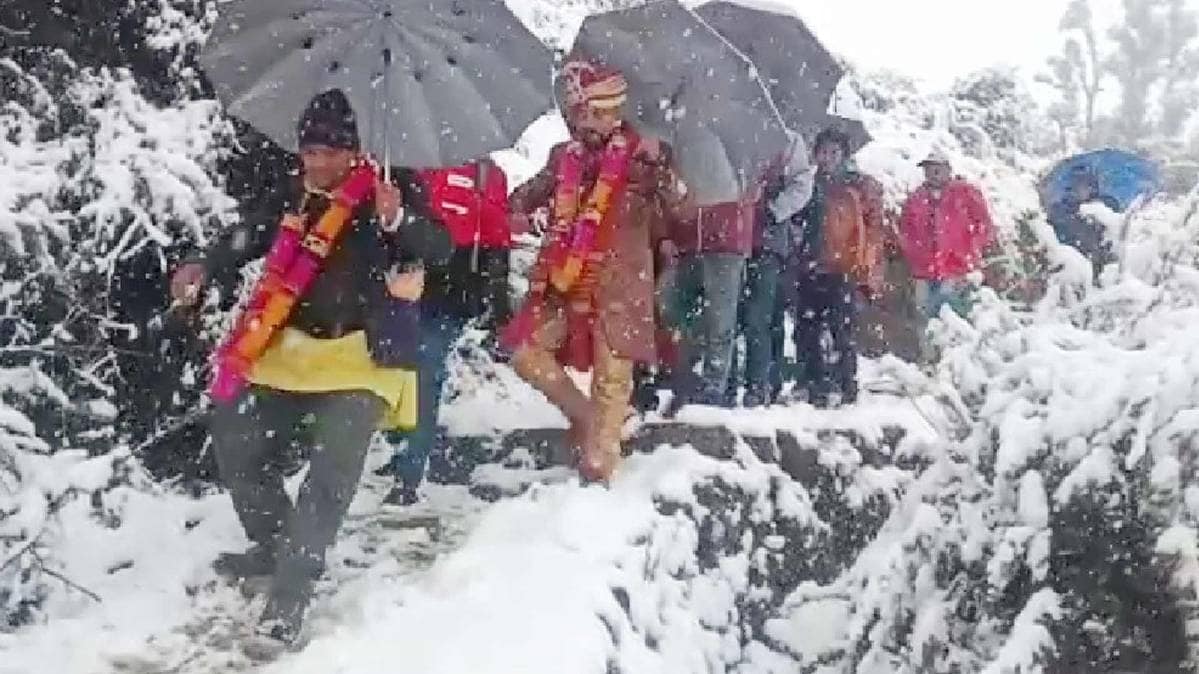 Uttarakhand: A groom travelled four km on foot to reach the bride's home in Bijra village in Chamoli district as roads were closed due to heavy snowfall in the region. (Photo ANI)
