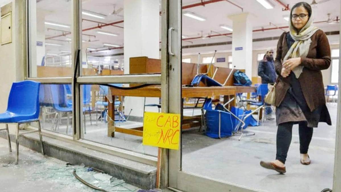 Broken window panes and chairs in the Jamia Millia Islamia (JMI) university's library following December 15 violence. (Photo: PTI)