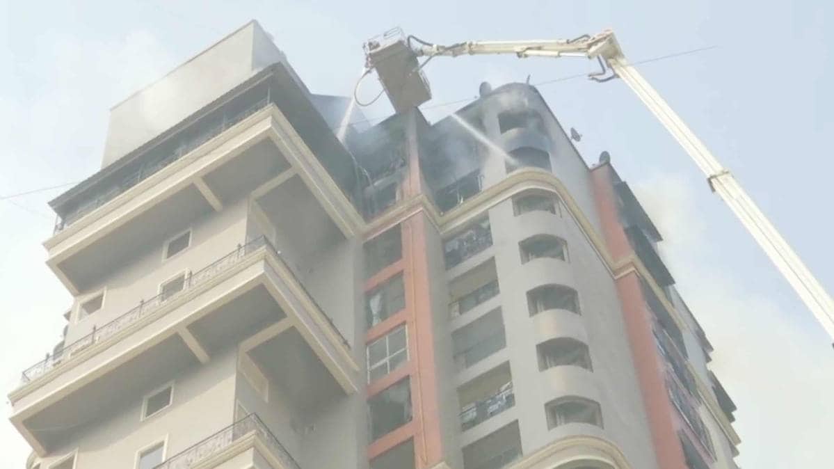 Navi Mumbai: Fire fighting operation underway at high-rise apartment building at Sector 44 Nerul Seawoods. (Photo ANI)
