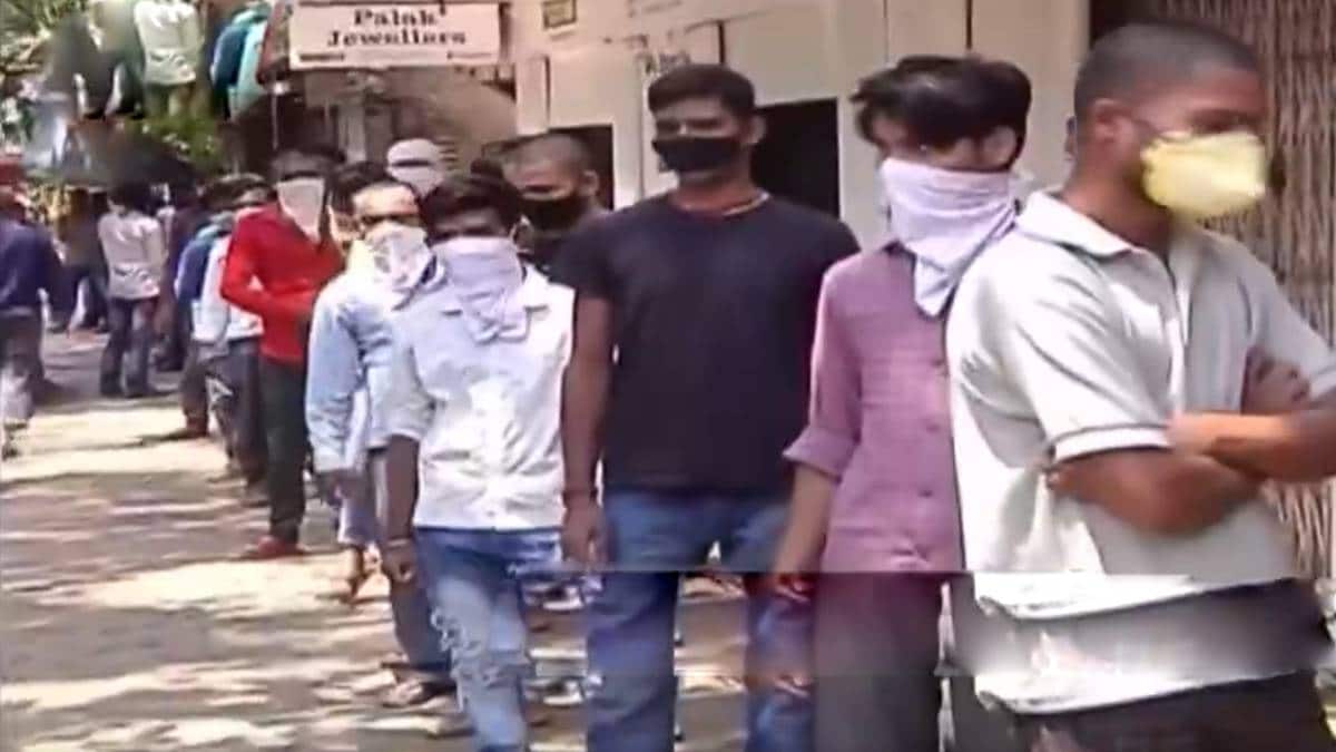 Migrant workers gathered outside Matunga police station