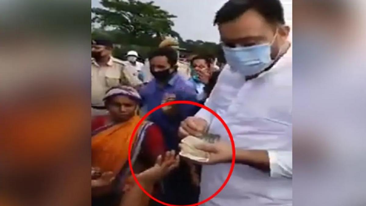 Tejashwi yadav old video of distributing cash