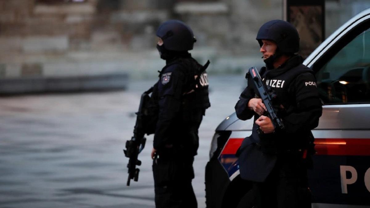 Police officers stand guard after exchanges of gunfire in Vienna. (Reuters)