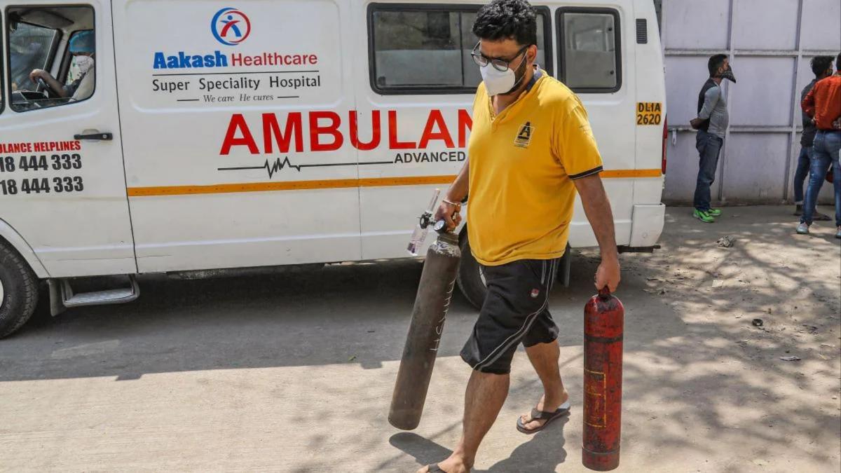 Man carries medical oxygen cylinder 