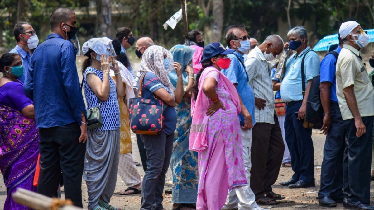People wait in queue to get COVID-19 vaccine dose (File-PTI)