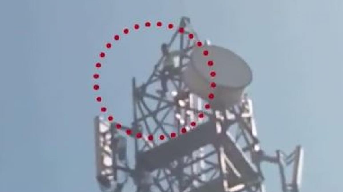 Man climbs tower 