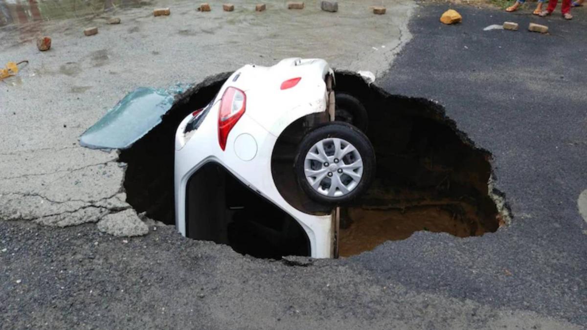 Car swallowed up in a sinkhole