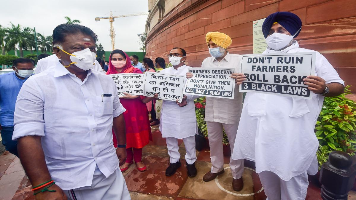 Oppn protest with banner- posters outside the Parliament