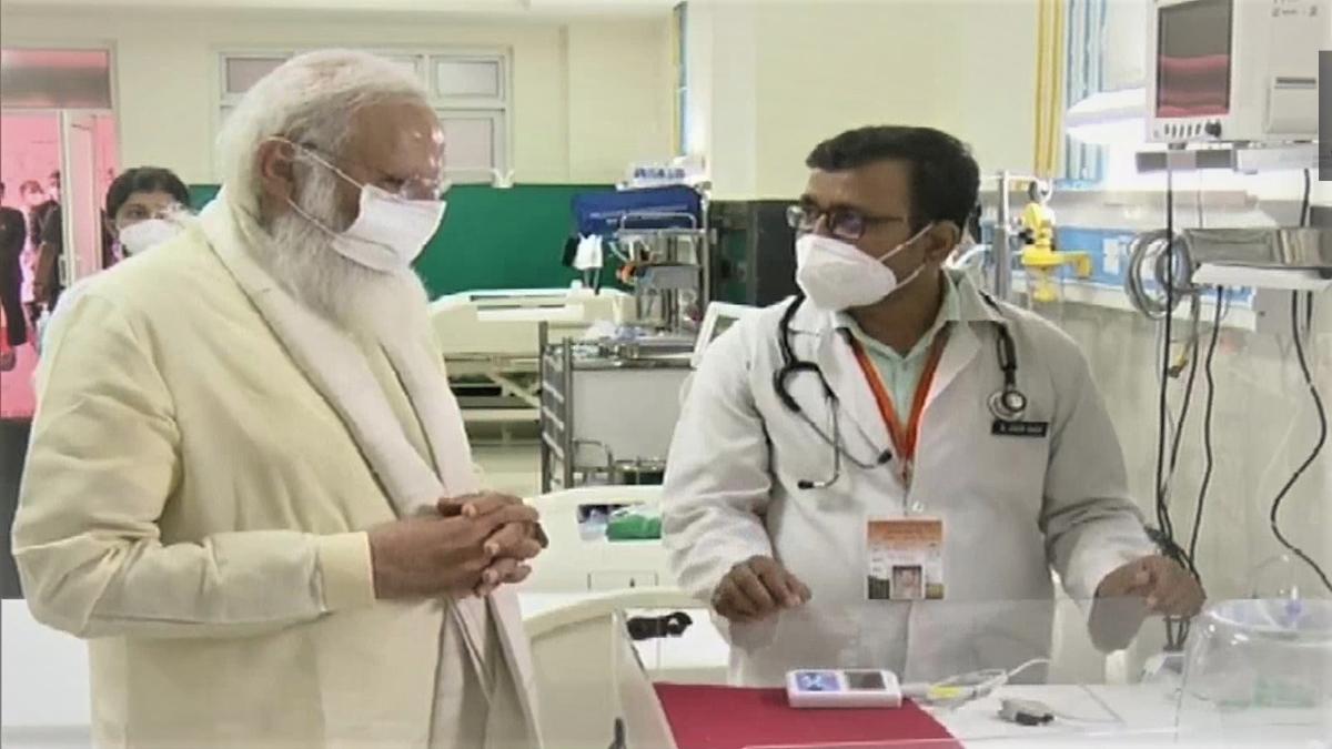 PM Modi interacting with doctors during inspection of Mother Child Health Wing 