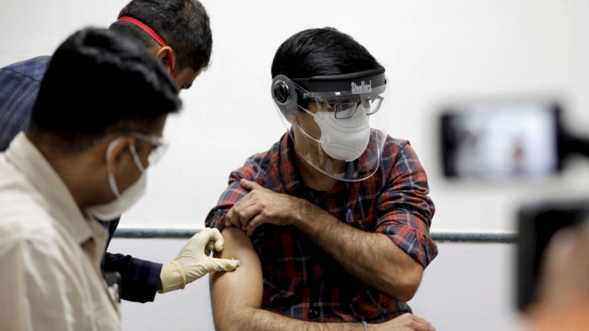 A youth taking Covid-19 vaccine dose