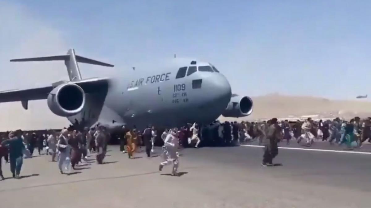 Kabul Karzai International Airport, Afghans ran on air strips in front of a US Air Force plane