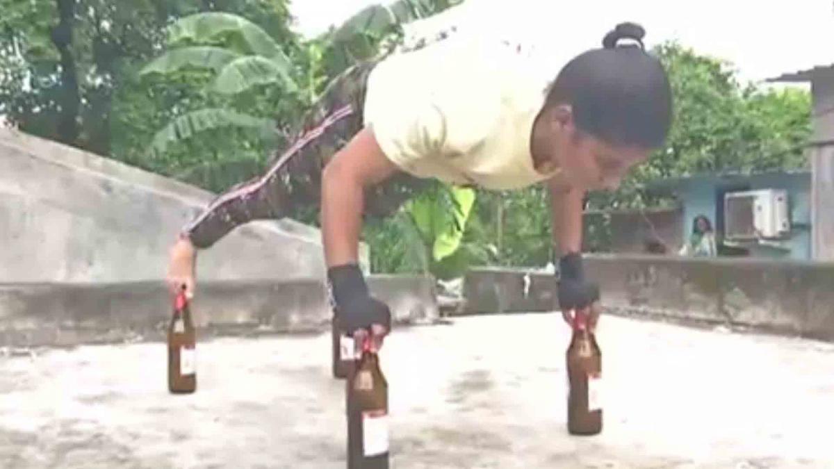 17 year old girl does push-ups on glass bottles