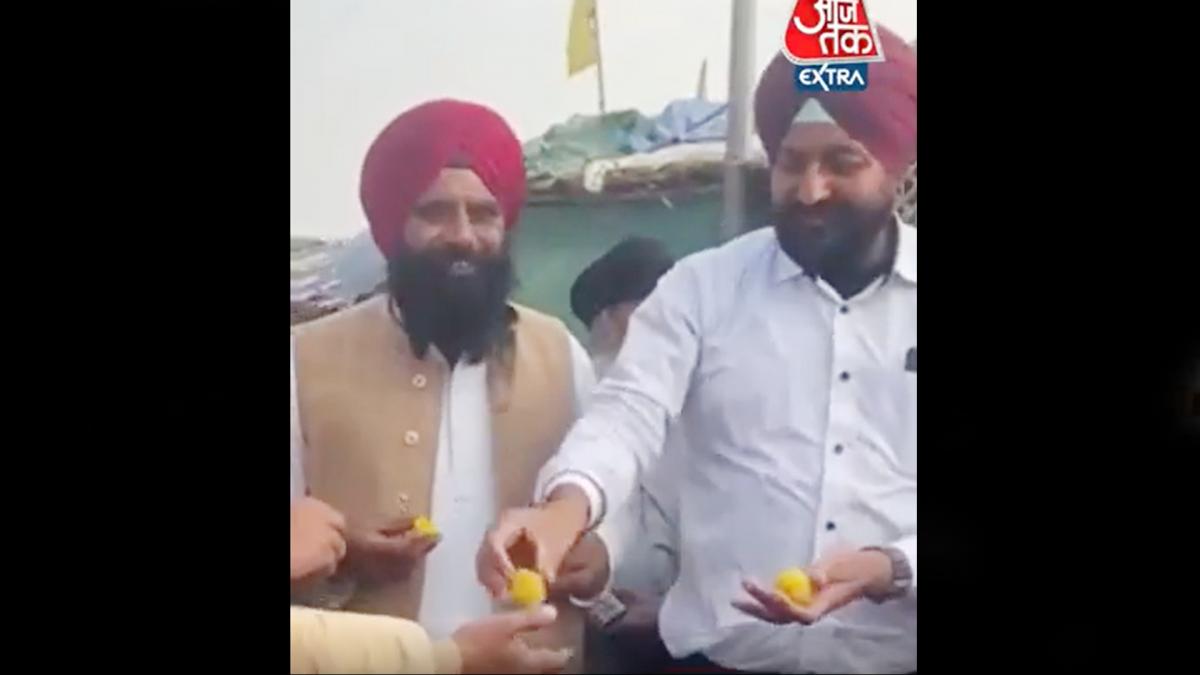 farmers celebrate and distribute sweets