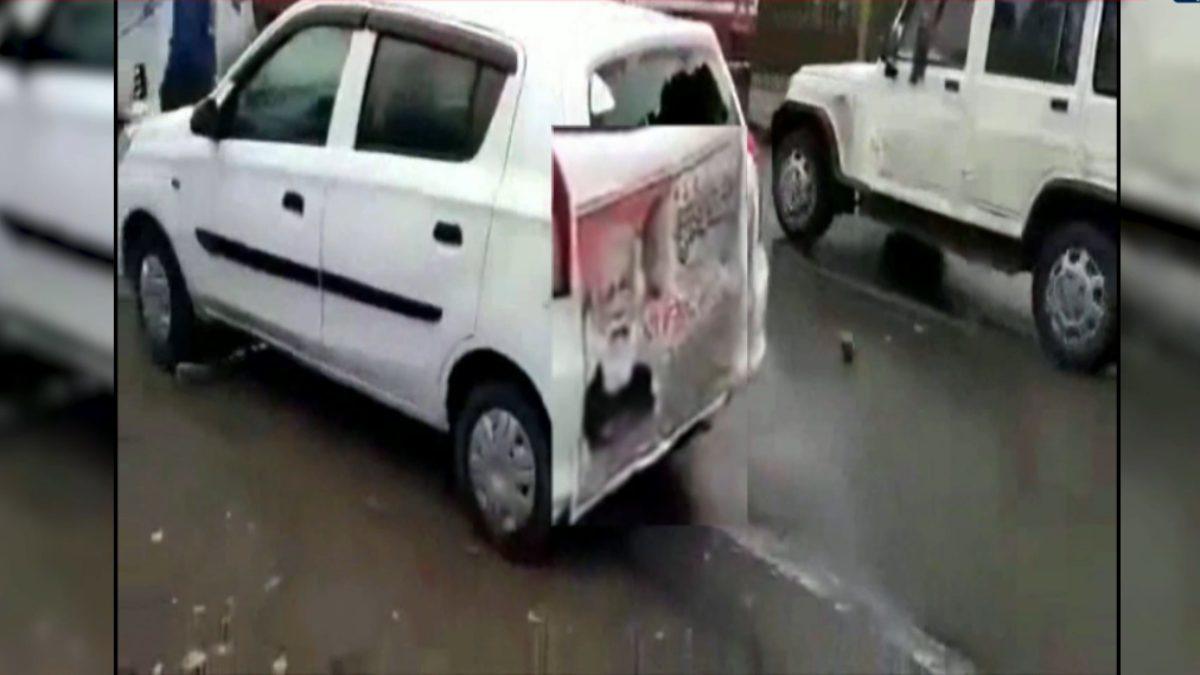 sp workers stone pelting bjp car
