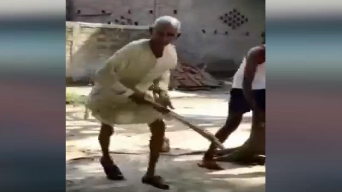 Old man playing cricket 