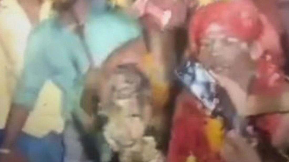 youths dance with half-burnt body parts