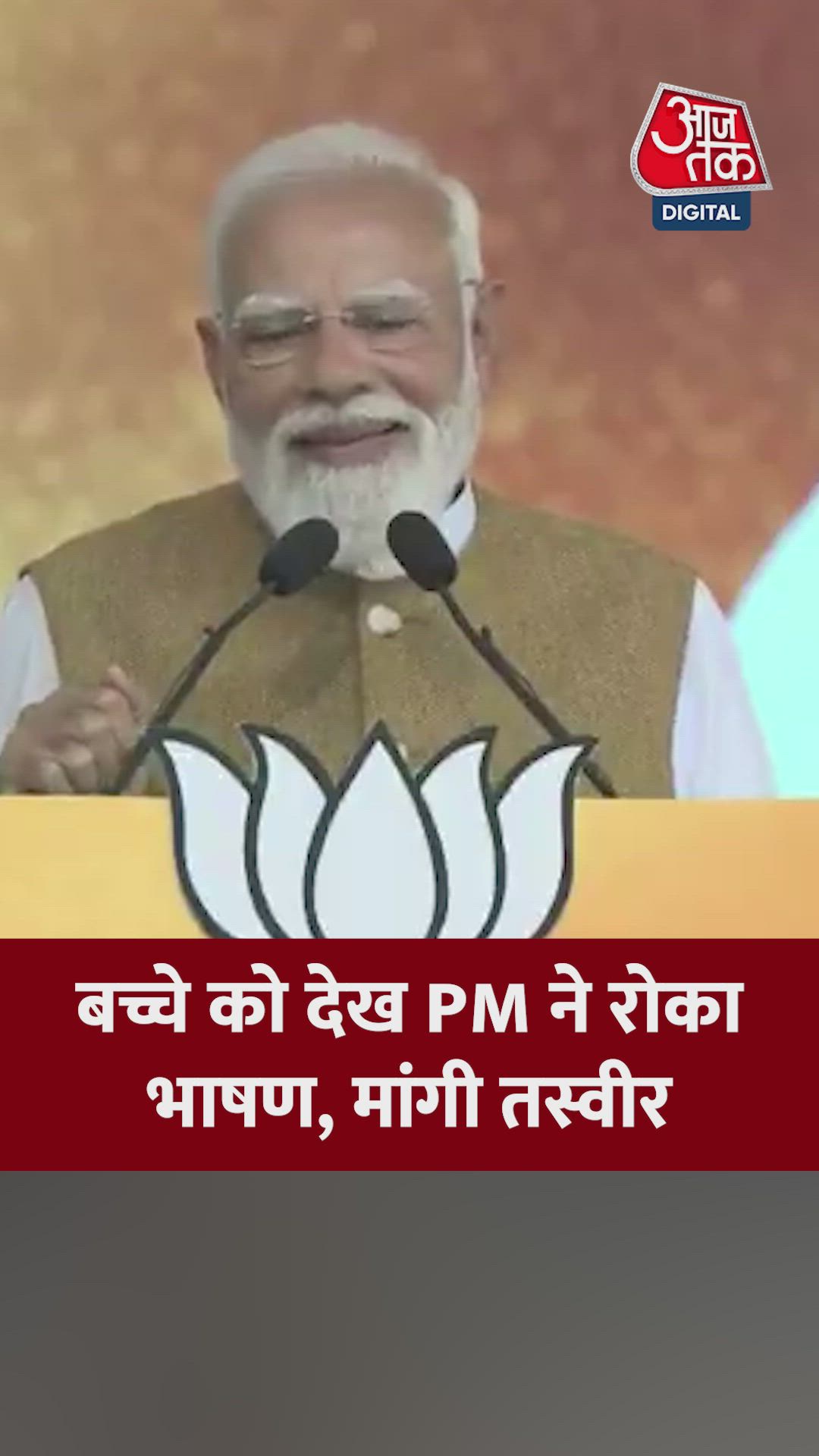 A boy standing with his hand raised