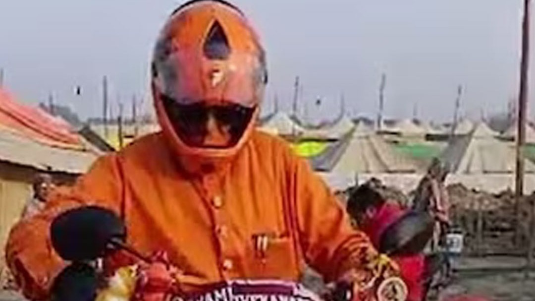 baba riding scooty at Prayagraj Magh Mela
